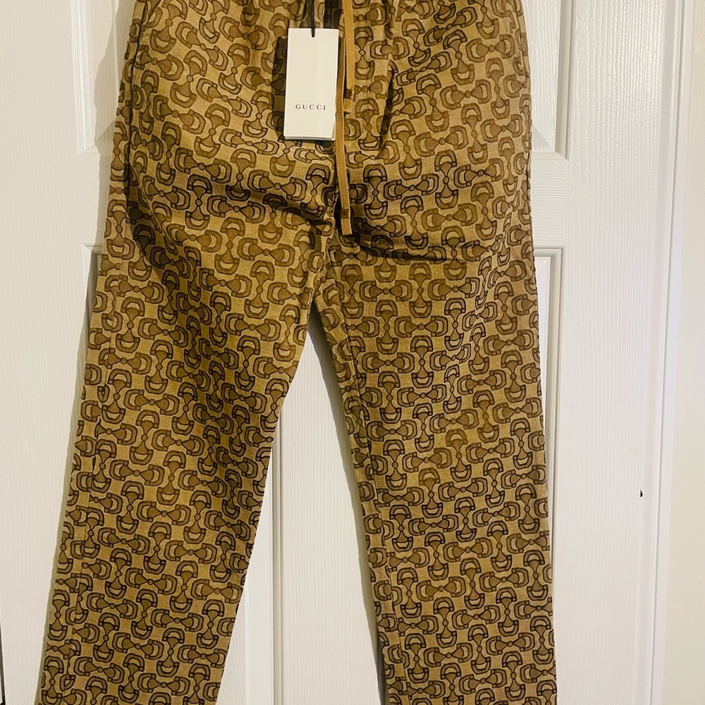 Gucci HORSEBIT JACQUARD-LOGO TRACK PANTS IN BROWN, LENGTH IS 40 inches.